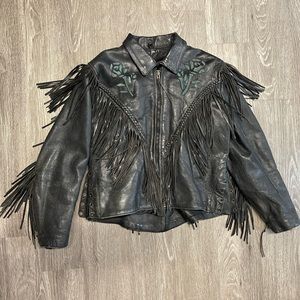 Vintage women’s leather coat, fringe and teal suede floral detail